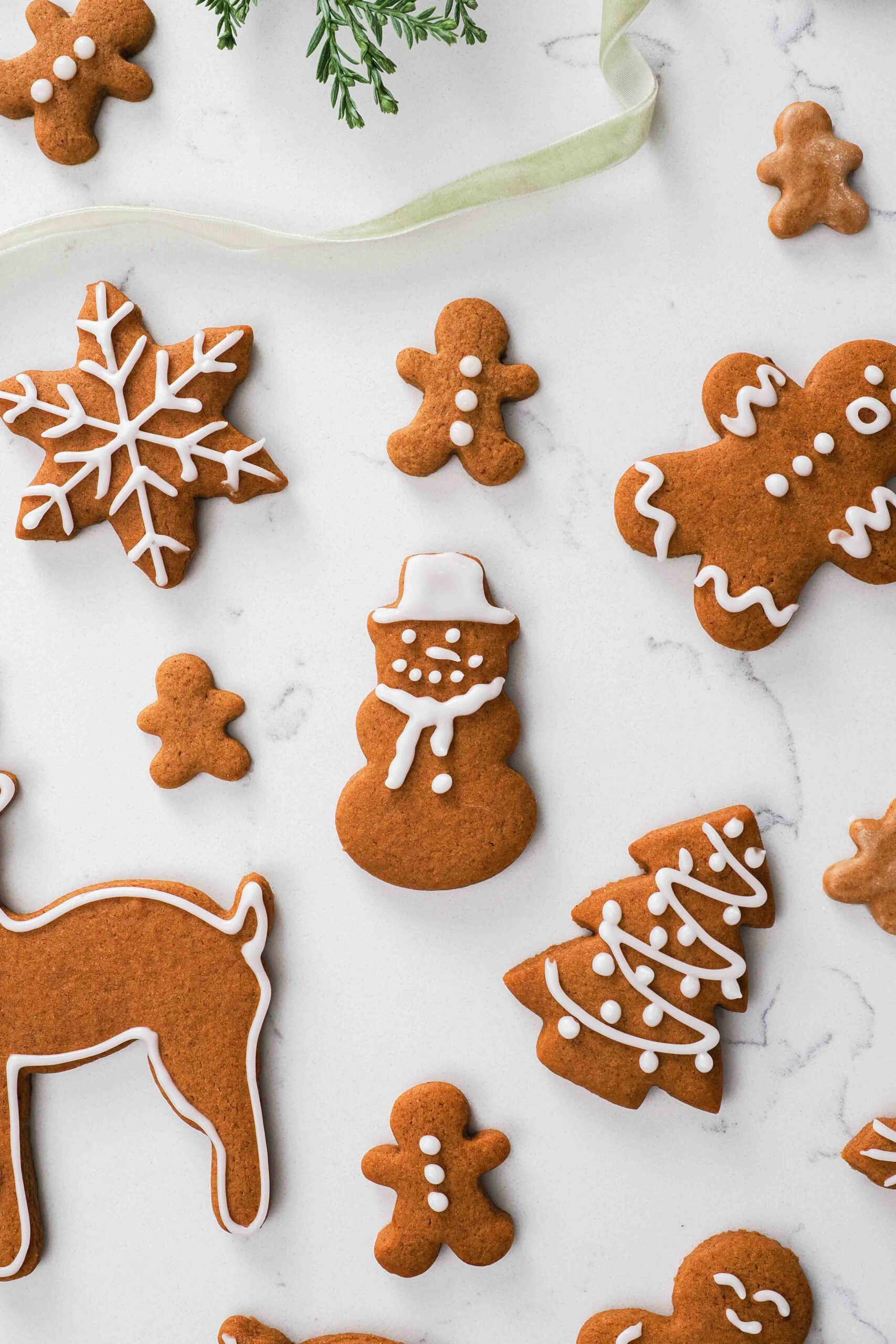 A gingerbread snowman amongst other gingerbread cookies.